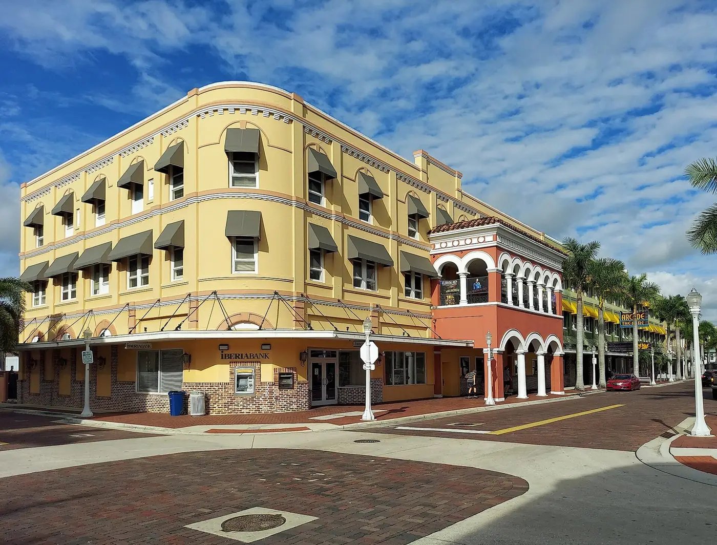 Historic Bradford Block building with arched windows and awnings in downtown Fort Myers